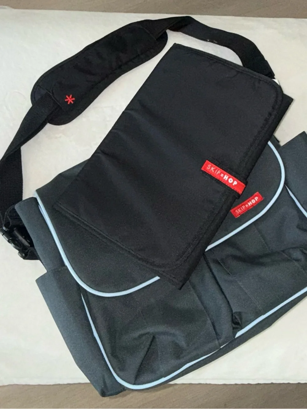 Skip Hop Black Messenger Bag with Light Blue Piping